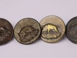 quatre types de boutons différents, sur lesquels figurent des images d'animaux