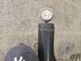 a baseball cap sitting on top of a table next to a baseball bat