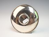 a silver object with a tag on it sitting on a table