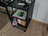 a small black cart with food on it in a room