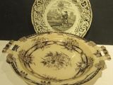 a plate and a bowl sitting on a table