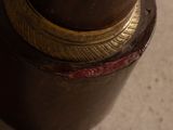 a close up of a vase on a table