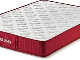 a close up of a red mattress on a white surface