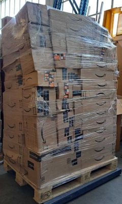 a large stack of boxes sitting on a pallet in a warehouse