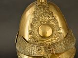 a gold helmet with a crown on top of it