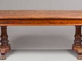 an image of a wooden table with two legs and a table top with a drop leaf