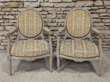 pair of antique chairs with upholstered upholstered back and arms