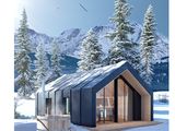 la couverture d'un magazine sur laquelle figure la photo d'une cabane dans la neige