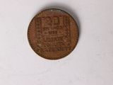 a close up of a coin on a white surface