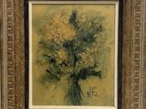 une peinture à l'huile représentant un bouquet de fleurs dans un cadre doré