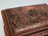 a wooden box with a picture of a deer and a man on it