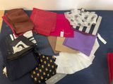 many different types of clothing on a blue mat