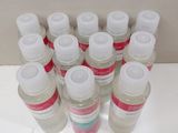 bottles of hand sanitizer sitting on a white counter top
