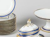 an assortment of porcelain dishes and plates on a table