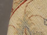 a close up of a rug with a cat on it ' s back