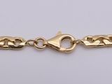 a gold chain with a heart clasp on a white background