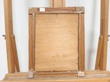 a picture of a wooden easel with a painting on it