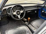 a view of a car ' s interior from the driver ' s seat