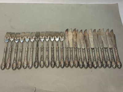a lot of forks and spoons on the table