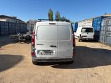 a white van that is parked in a parking lot