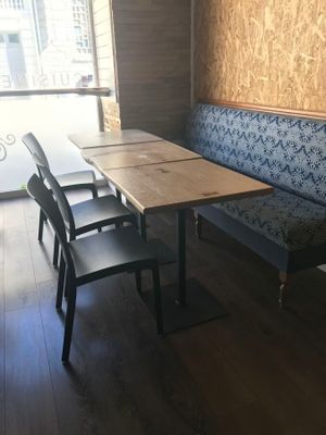 a table and chairs in the corner of a room