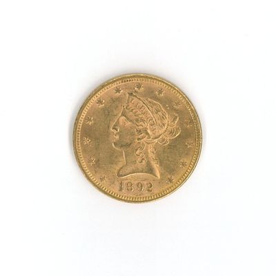 une image d'une pièce d'or sur une surface blanche