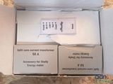 two boxes of electronic devices in a box on a table