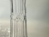 a clear glass vase sitting on top of a table