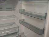 a refrigerator with its door open and shelves full of food