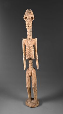 une figurine en bois représentant un homme avec un chapeau sur la tête