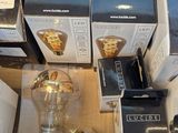 many boxes of wine glasses and a bottle in a box
