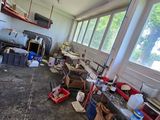 an image of a garage with a lot of clutter