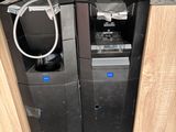 a picture of a computer and a printer in a room
