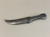 a small knife that is laying on a table