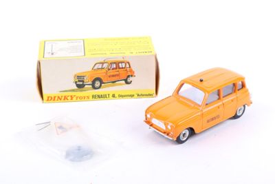an orange toy car sitting next to a boxed box