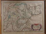 an old map of scotland in a wooden frame hanging on a wall