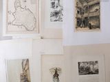 a lot of pictures on the wall of a room