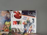 a lot of comic books sitting on a table