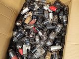 a cardboard box filled with many different types of electrical components