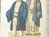 two men in blue robes standing next to each other