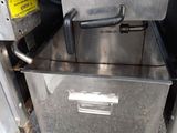 an image of a commercial fryer with a metal cabinet