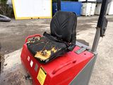 an image of a seat on a forklift in a parking lot
