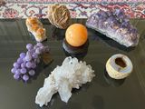 many different types of crystals on the table
