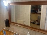 a bathroom with a sink and a mirror on the wall