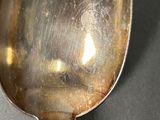 a spoon that is sitting on a table