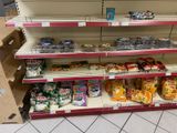 a lot of snacks on the shelves in the store