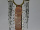 beaded necklace on stand with chain and bead fringes