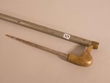 pair of antique wooden handled tools on a white surface