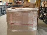 boxes are stacked on a cart in a large warehouse