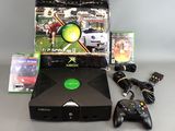 a video game console and a game controller on a table